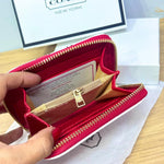 Cartera Coach Snap con estampado de cereza y corazón