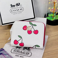 Cartera Coach Snap con estampado de cereza y corazón